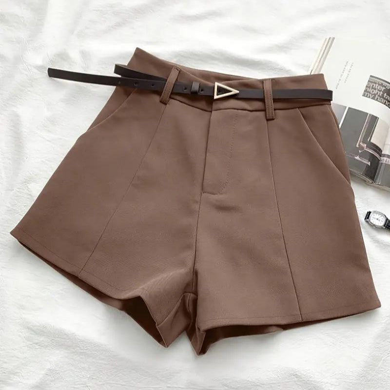 Brown shorts with a belt on a white background