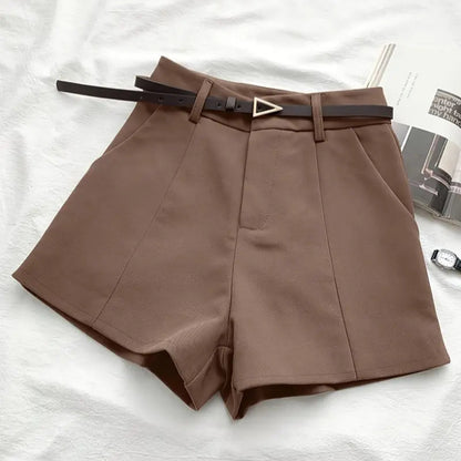 Brown shorts with a belt on a white background